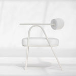تحميل الصورة إلى عارض المعرض، The Wanda dining chair in white, featured in a minimalist dining area, offering timeless charm.