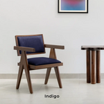 تحميل الصورة إلى عارض المعرض، The Pierre wood frame dining chair in a sophisticated dining space, blending classic and modern styles.