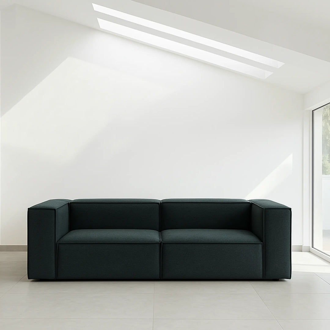 Luxury couch styled in a spacious villa living room with upscale decor, available to buy online.