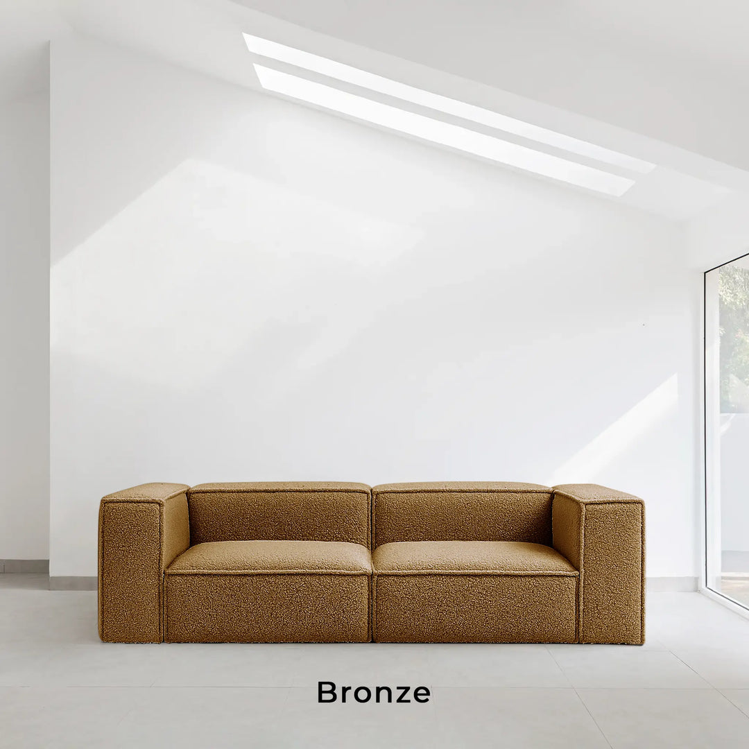 Luxury couch styled in a spacious villa living room with upscale decor, Bronze color and febric