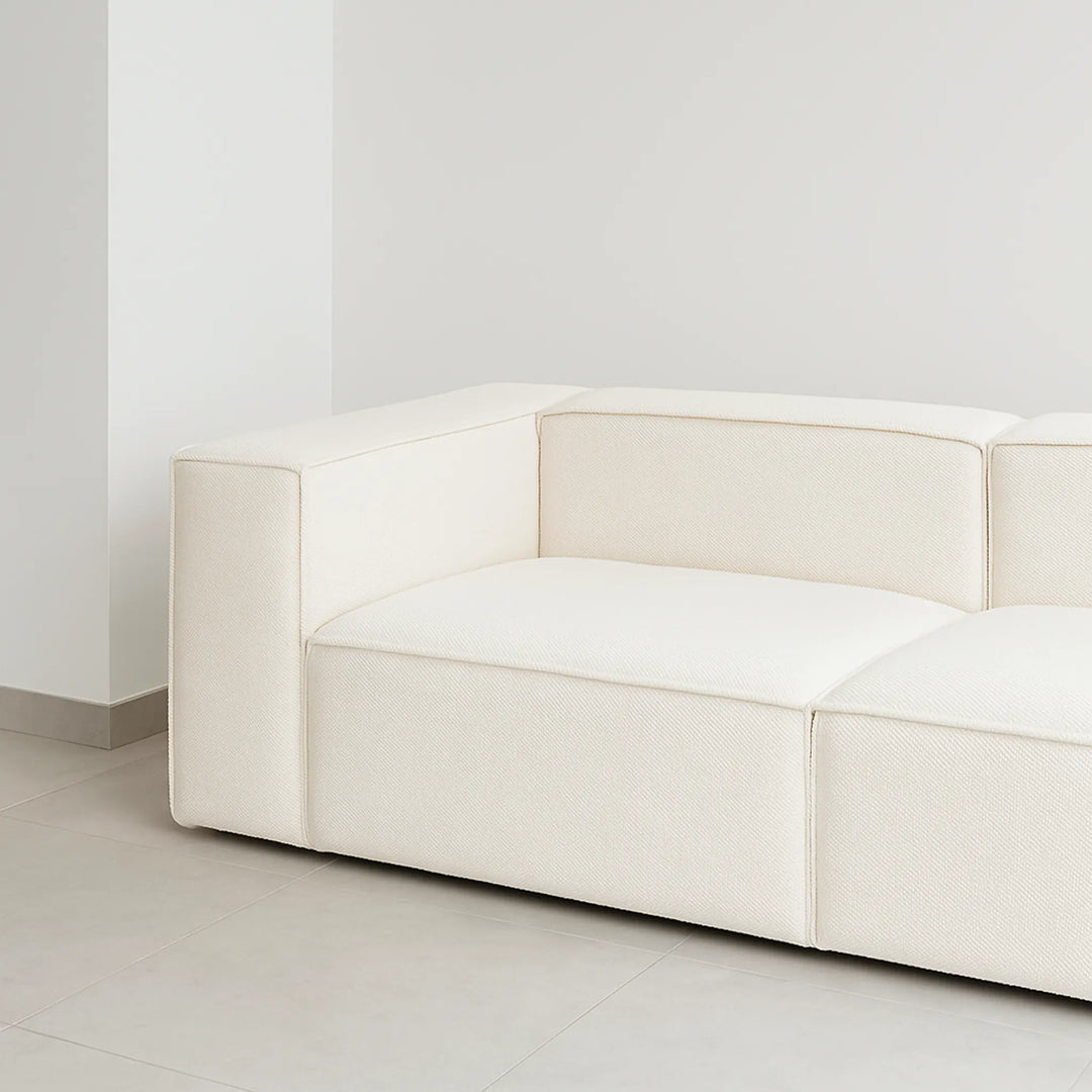 White modular couch in a bright open-concept living room, offering both style and comfort.