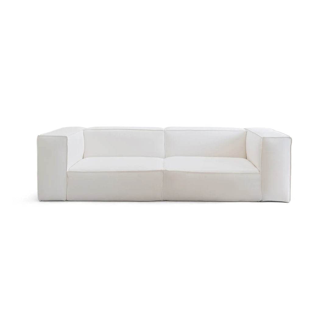 The Damien Modular Couch with a sleek white design on a plain background, perfect for modern homes.