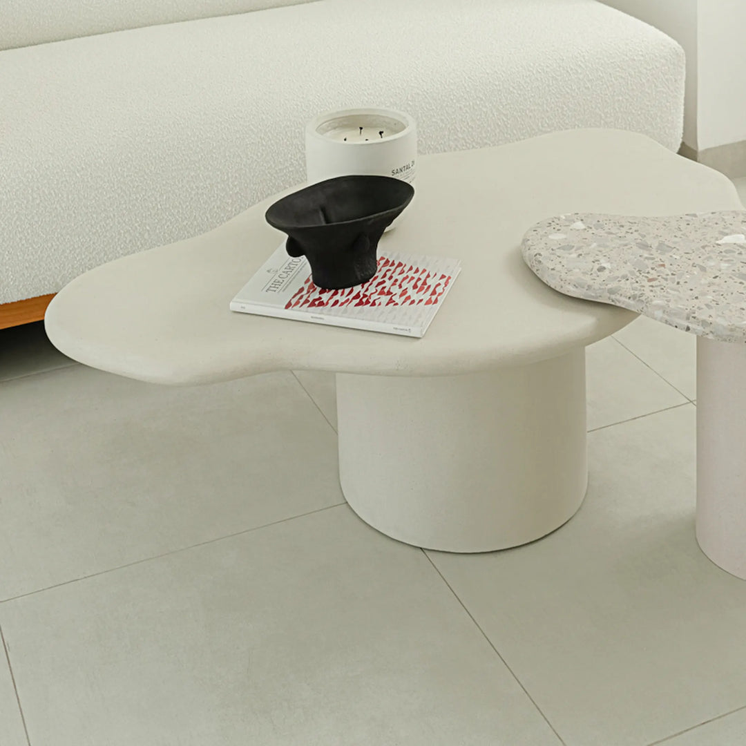 The Elon Nesting Coffee Tables, with their white marble design, elevate the room's aesthetic while providing versatile functionality.