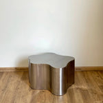 تحميل الصورة إلى عارض المعرض، A beautiful, medium-sized steel coffee table in a cozy, contemporary setting, perfect for entertaining guests.