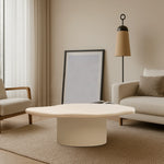 تحميل الصورة إلى عارض المعرض، The Jamie Coffee Table pops against dark hardwood floors, combining soft tones with a glass top – a stylish and affordable round coffee table UAE residents will find versatile.