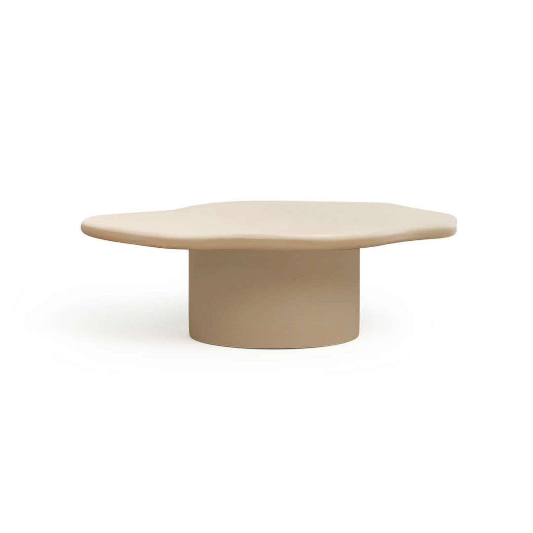 The Jamie Coffee Table in Micro Plaster with a sleek glass top and sculptural base – a modern white coffee table round in design, ideal for UAE interiors.