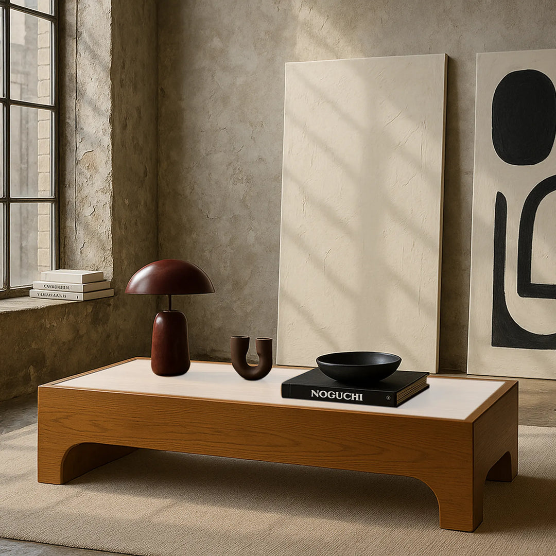Low square wood coffee table, The Noah, complements the surrounding decor in this lifestyle image, offering both utility and elegance.