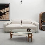 تحميل الصورة إلى عارض المعرض، Decor-ready and inviting, The Scott Coffee Table features a round glass surface ideal for showcasing books or floral arrangements, atop a modern wooden base.
