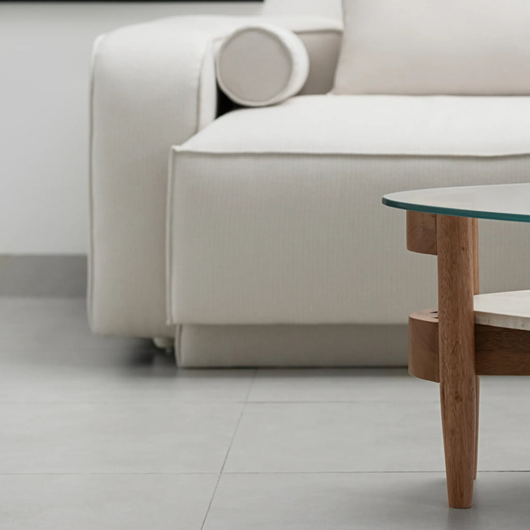 Aerial view of The Scott Coffee Table, showcasing its symmetrical design and elegant circular glass top – a wooden base round glass coffee table made for stylish homes.
