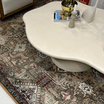تحميل الصورة إلى عارض المعرض، Detail of The Jamie Coffee Table’s micro plaster texture and smooth glass top – a high-end round center table with glass top offering timeless sophistication.