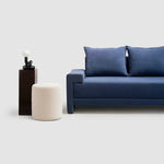 تحميل الصورة إلى عارض المعرض، Modern white sofa seamlessly blending with a contemporary home setting for a chic ambiance.