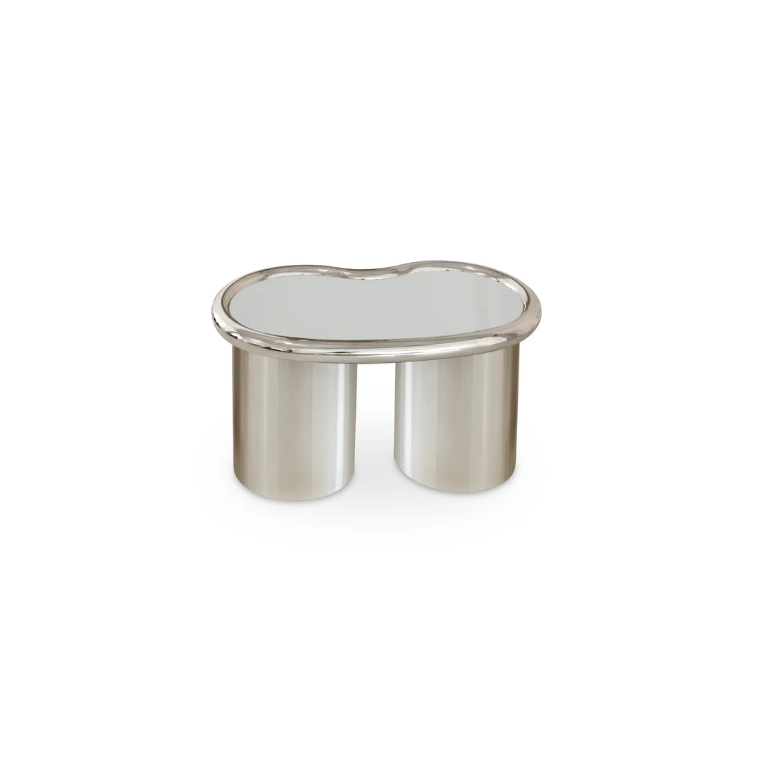 The Willow Chrome Coffee Table With Small Gestures—compact glass-top table with stainless steel legs, ideal for modern minimalist interiors.