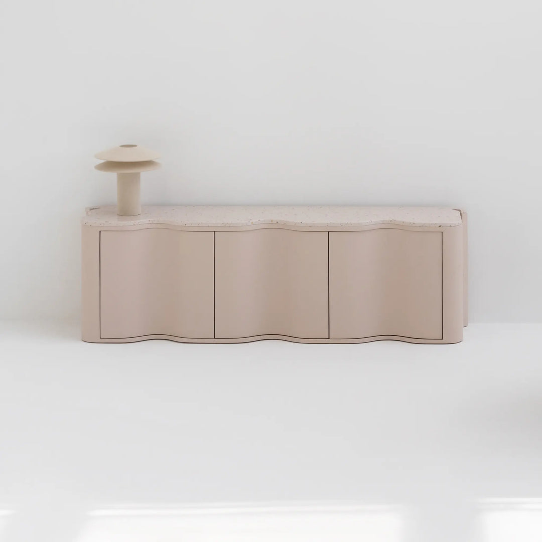 Cream color TV stand, a bold centerpiece in a chic and modern family room.