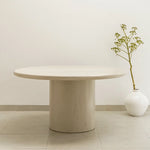 تحميل الصورة إلى عارض المعرض، The Marx Microplaster round dining table styled in a contemporary dining room, offering both elegance and function.