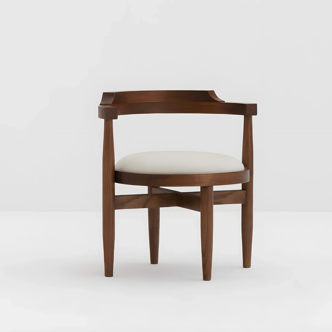 The Naomi wooden chair in a neutral grey background, highlighting its simple yet elegant craftsmanship.