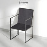 تحميل الصورة إلى عارض المعرض، The Joelle dining chair with iron legs, adding an industrial edge to a bright and airy dining space.