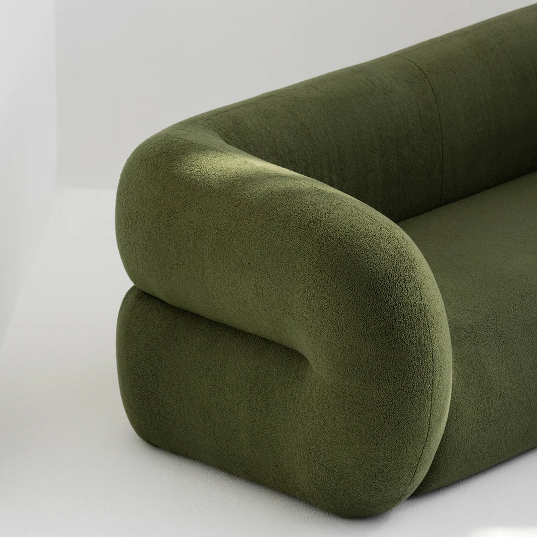Stylish seating sofa with colorful upholstery, highlighted on a neutral grey background.