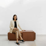 تحميل الصورة إلى عارض المعرض، Stylish lifestyle image featuring a woman with Sebastian Coffee Table and Italian ottoman.