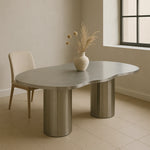 تحميل الصورة إلى عارض المعرض، The Victoria curvy steel dining table with a stainless steel surface, perfect for hosting family and friends.